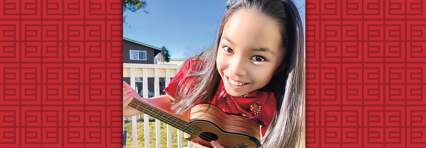 Image of a teen playing the ukulele